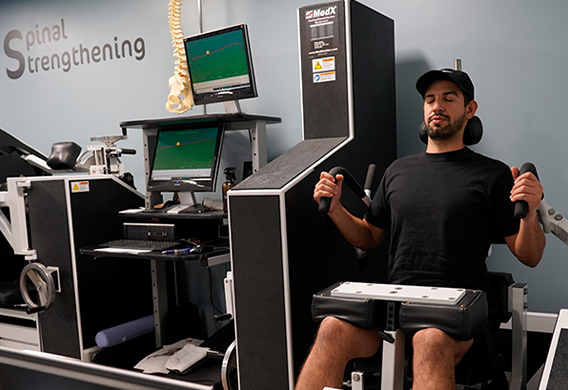 MedX spinal rehabilitation machine for lumbar and cervical strengthening treating disc herniation and spinal pain in Redmond