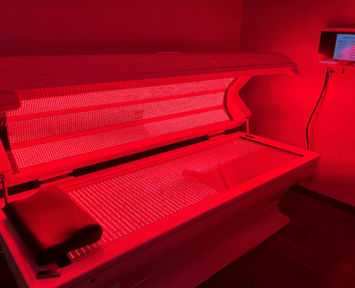 Full-body LED red light therapy table for pain recovery and healing in Redmond